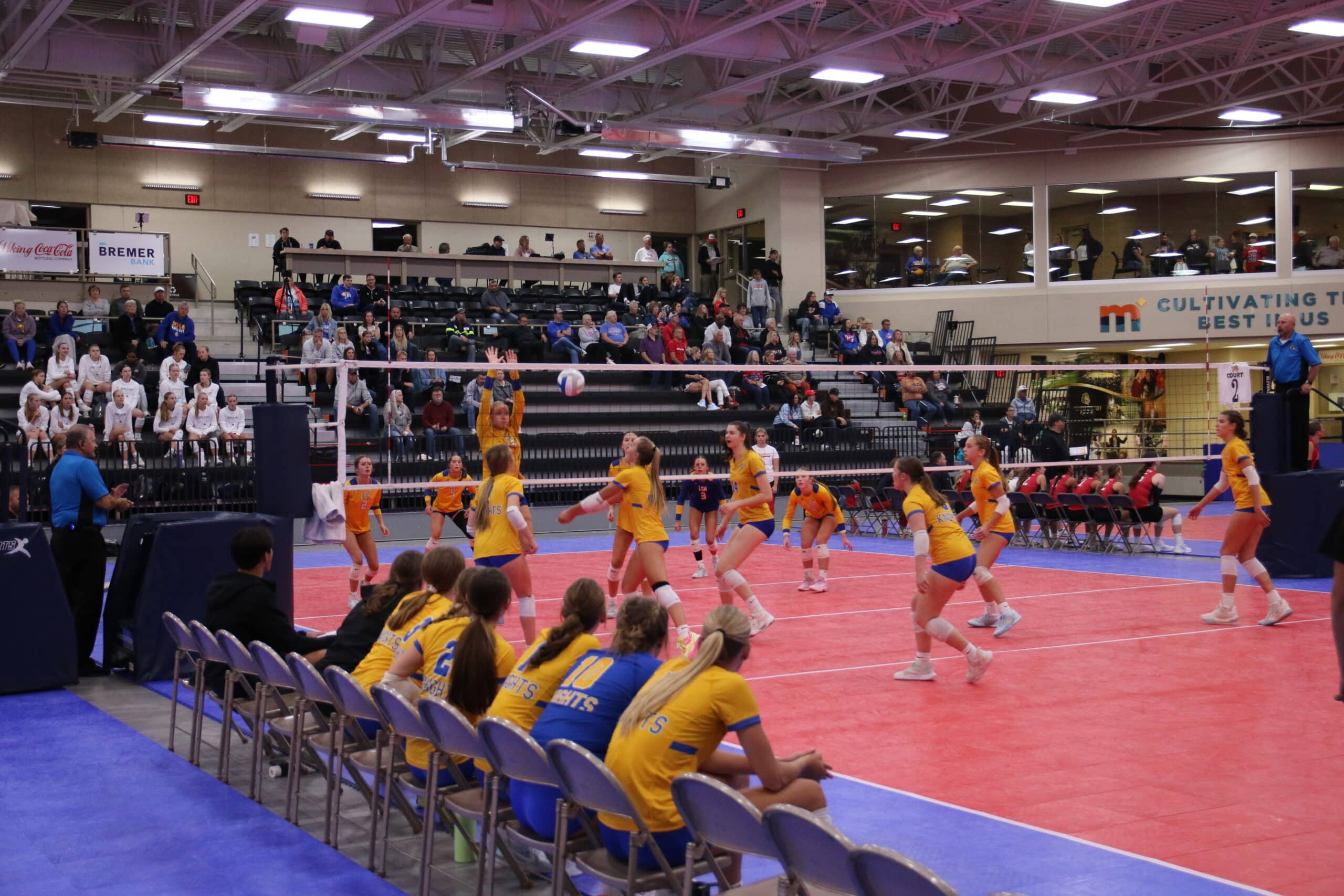 group of girls playing in volleyball tournament