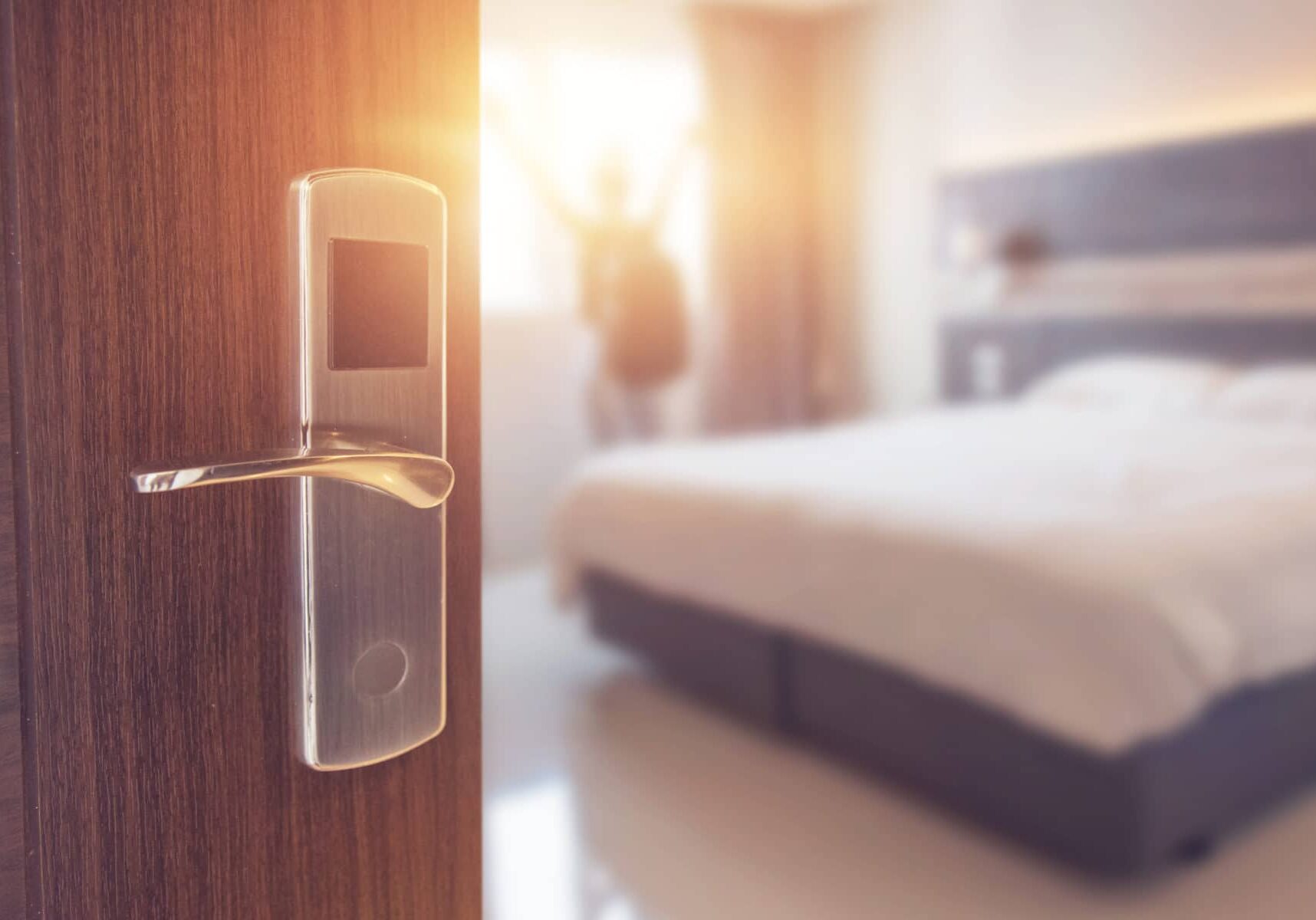 Opened door of hotel room in morning